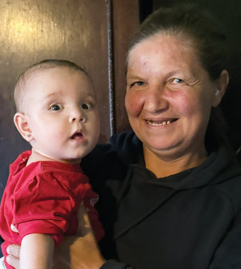 nov1-mother-and-baby Mother holding a baby from the family described in the November 1, 2026 letter.